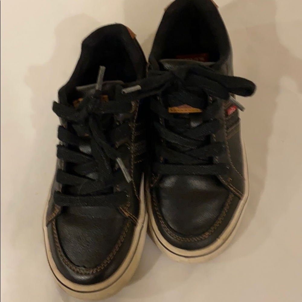 Levi’s size 13 shoes.